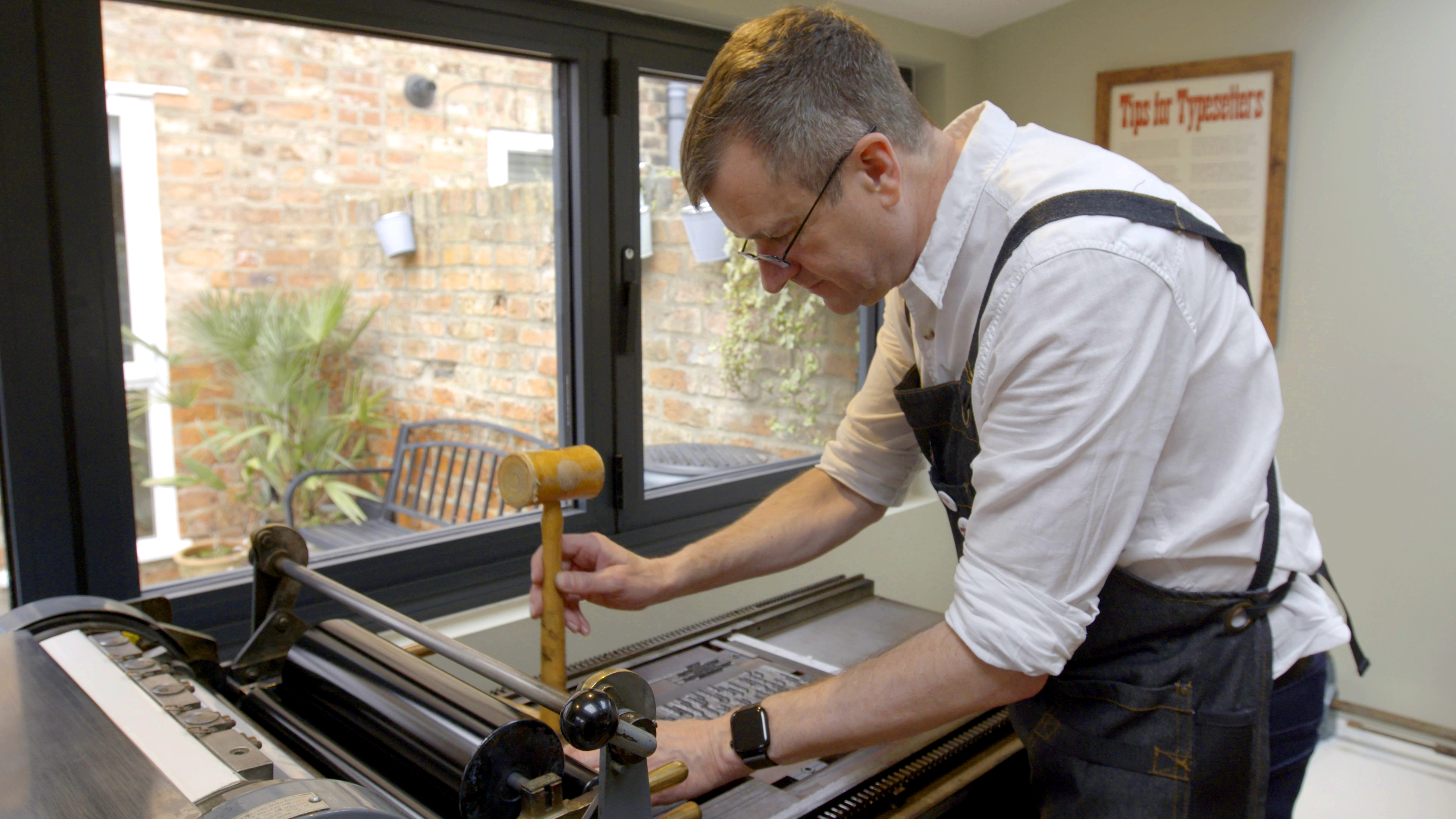 Dave Harper at the Vandercook press