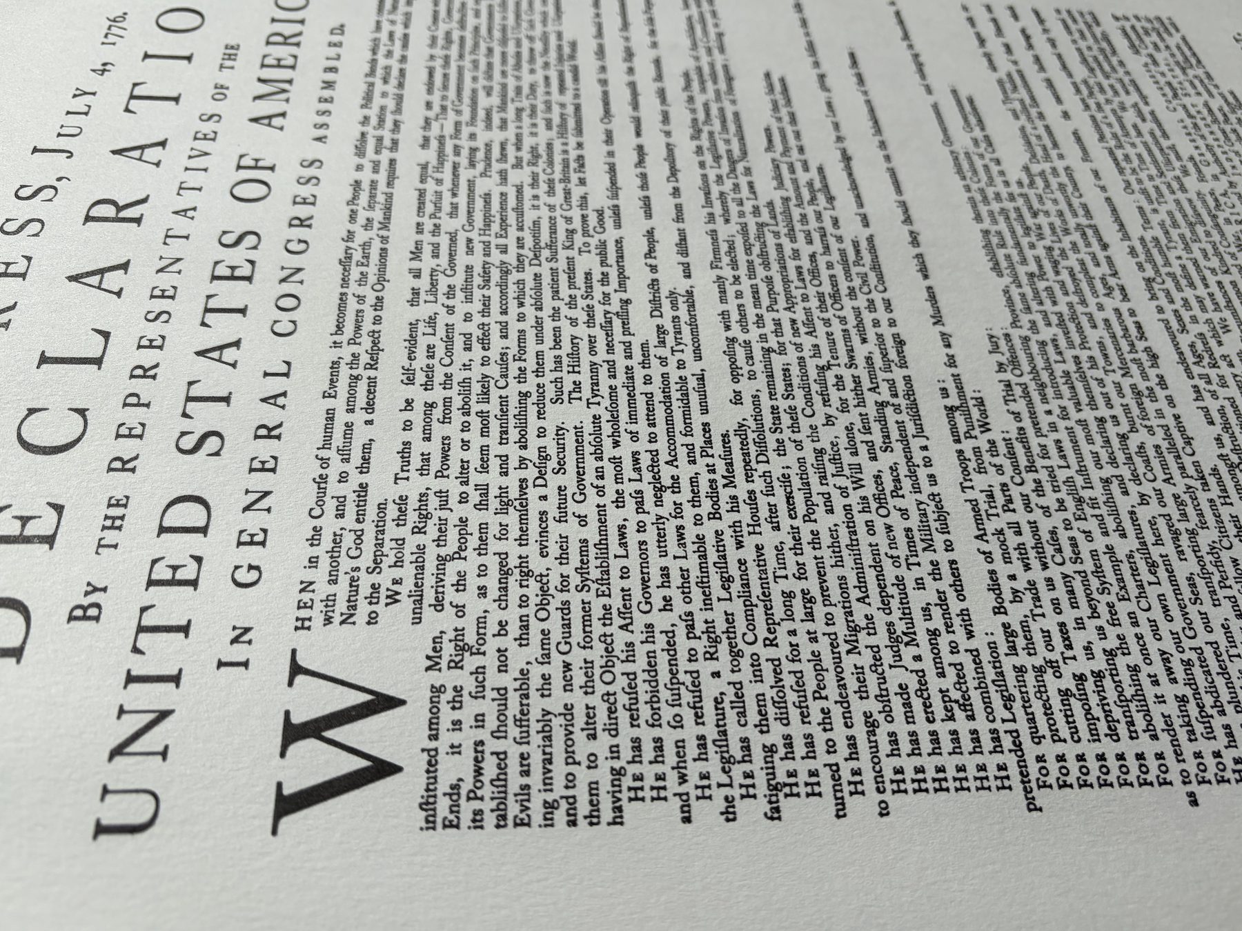 Raking light across the printed sheet showing the depth of the letterpress impression